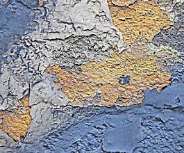 Rust on the iron. The textures and background of cracked blue and yellow paint on the metal