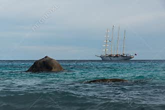 Boulders and sailboat