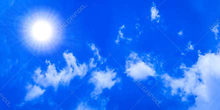 Glowing Sun in Blue Sky