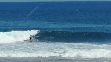 Surfers point a famous big wave location at margaret river