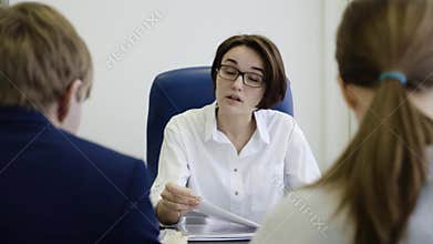 Woman boss punishes workers for work. Businesswoman unhappy with the work of employees in the office