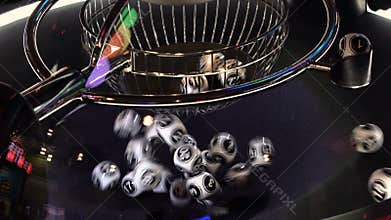 Black and white lottery balls in a rotating bingo machine. 4k