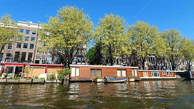 Amsterdam, Netherlands. 25.04.2019. Restaurants located in the canals of Amsterdam. View from the tour boat. Shot with a