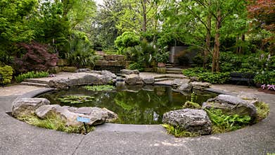 Fountain and garden titled `Genesis Garden` in the Dallas Arboretum and Botanical Garden
