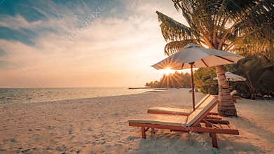 Beautiful sunset beach. Chairs on the sandy beach near the sea. Summer holiday and vacation concept. Inspirational tropical scene.