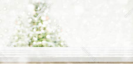Empty white wooden table top with abstract muted blur christmas