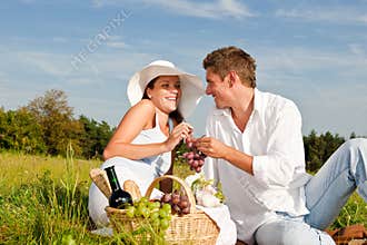 Summer picnic - Happy couple in meadow