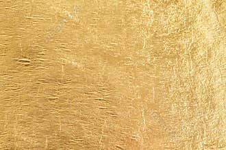 Gold shiny foil background, yellow gloss metallic texture