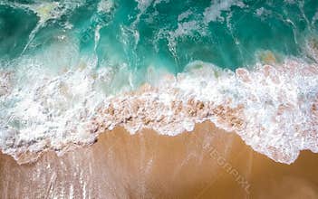 Sand beach aerial, top view of a beautiful sandy beach aerial shot with the blue waves rolling into the shore