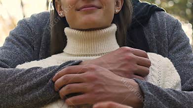 Caring boyfriend tightly embraces beloved girlfriend, never letting go, love