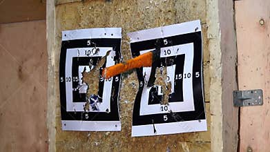 Flying axe. Man is throwing an axe. Tournament. Axe throwing