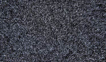 Texture of a black carpet. Background of wool.