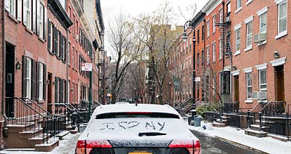 I love NY written in snow on a car parked in New York City