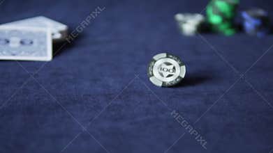 Black poker chip spinning slowly
