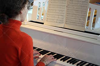 Woman play on piano