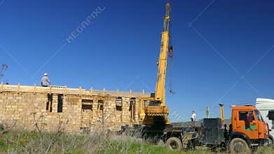 The mobile crane moves an empty boom