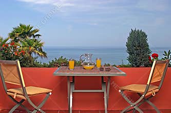 View of sea and blue sky from terrace in Spanish villa.