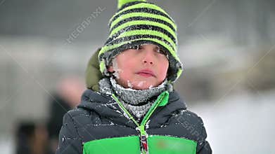 Cute Happy Boy Smiling with a Snowy Face