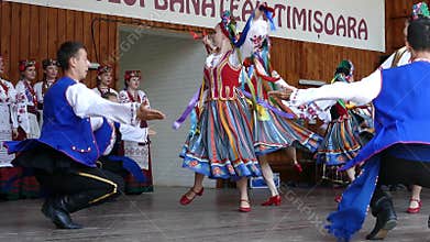 Young Ukrainian dancers in traditional costume, perform folk dance