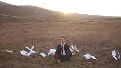 Businessman relaxing on nature