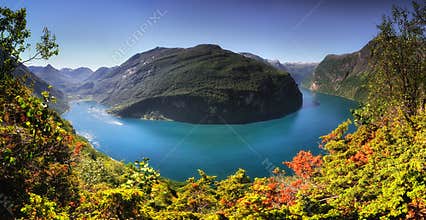 Panoramic aerial landscape of Geiranger fjord in Norway from mountain viewpoint. High resolution panorama