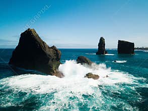 Aerial picture of wild rock formations in the middle of the open atlantic ocean next to Mosteiros, in Sao Miguel island, Azores, P
