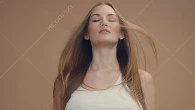 Deep breathing caucasian woman with hair moved by air