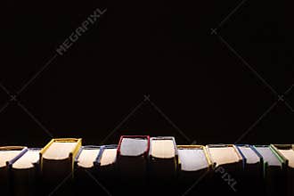Books In Library On Black Background With Copy-Space. Concept Of Education And Knowledge