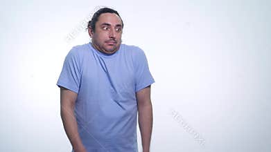 Portrait of handsome emotional man in T- shirt in a pose I do not know on white background