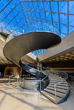 The Spiral stairs of the Louvre Museum and Glass Pyramid