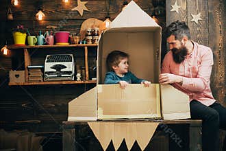 Education and kid idea development. education concept with family of father and little kid in paper rocket.