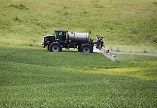 Farming tractor spraying