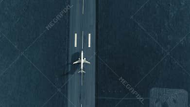 Aerial view of the airplane on take-off approach at the airport runway. top view