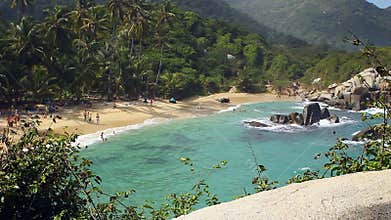 CABO SAN JUAN DE LA GUÍA, TAYRONA NATIONAL PARK, COLOMBIA - People enjoy their vacations at the beach