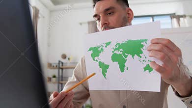 teacher with world map having online class at home