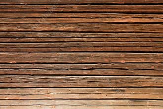 Old wooden log house wall