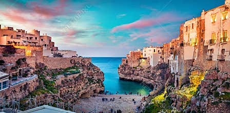 Spectacular spring cityscape of Polignano a Mare town, Puglia region, Italy, Europe. Colorful evening seascape of Adriatic sea.