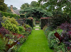 Red Border at the Arts and Crafts garden at Hidcote Manor in the English Cotswolds, Gloucestershire UK