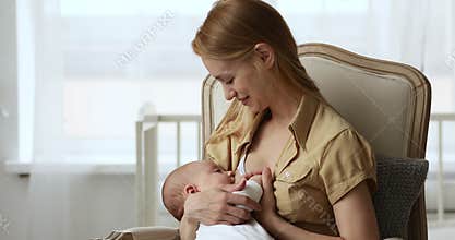 Cute adorable baby drinks mothers breast milk