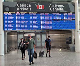 Arrivals board Pearson Airport Toronto
