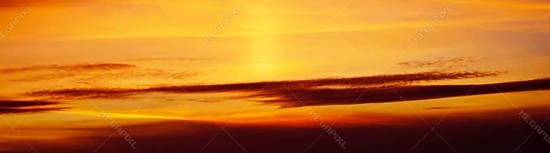 Yellow orange red sunset. Beautiful evening sky with clouds. Skies background.