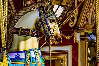 Golden Carousel Horse poised for the next rider