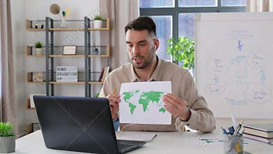 teacher with world map having online class at home