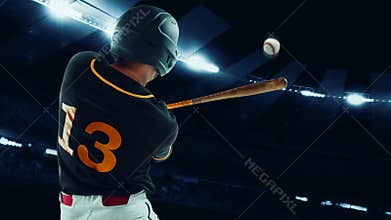 Back view of professional baseball player with baseball bat in action during match at stadium at evening time. Sport