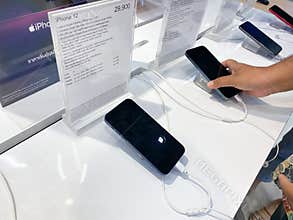 Trang,Thailand December - 6, 2020 : Customer try iphone 12 pro max for make decision with information at distribution center