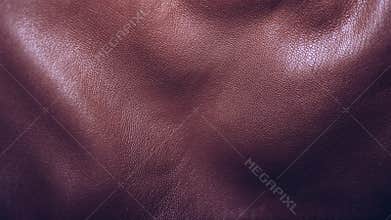 Crumpled brown leather texture, convex background with curves, textile, copy space. Genuine leather background