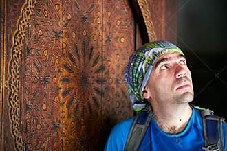 Backpacker admiring Saadian Tombs in Marrakech