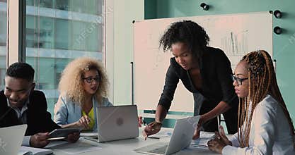 African leader and staff take part in brainstorm in boardroom