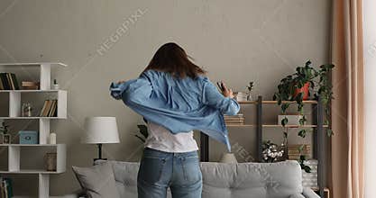 Woman reading sms celebrate great news jumps feels excited