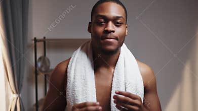 male skincare african man dancing touching face